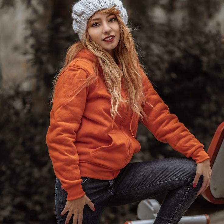 Maya Arun, Lead Design Curator at CloverHarborLane, reviewing corporate floral arrangements